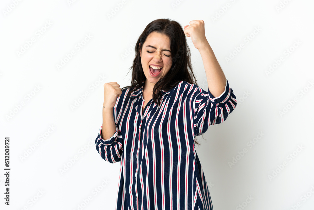 Young caucasian woman over isolated background celebrating a victory Young caucasian woman over isolated background celebrating a victory