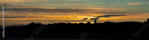 City skyline at sunset at dusk with blue and orange tones © SDF_QWE