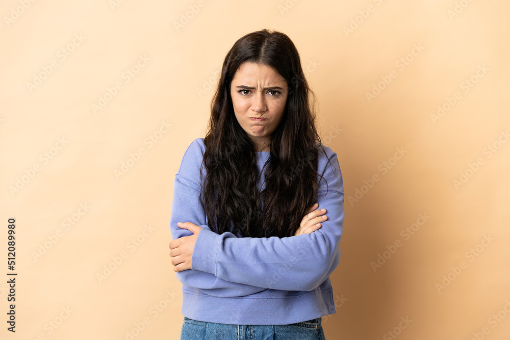 Young caucasian woman over isolated background with unhappy expression Young caucasian woman over isolated background with unhappy expression