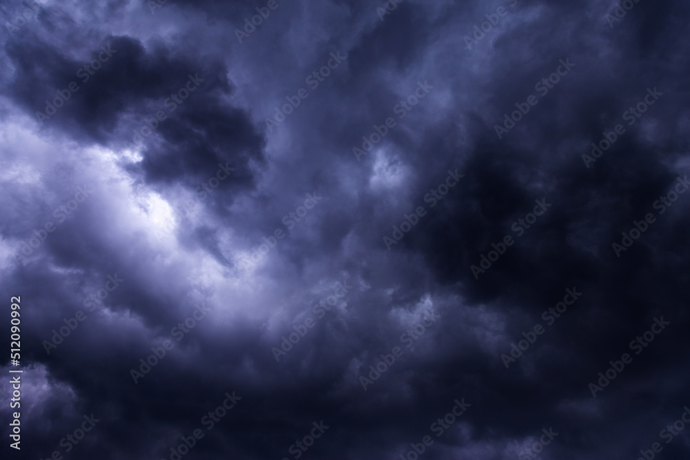 Storm sky with dark blue violet cumulus rainy clouds background texture, thunderstorm