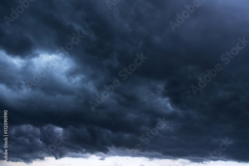 Storm sky with dark blue cumulus rainy clouds background texture, thunderstorm 