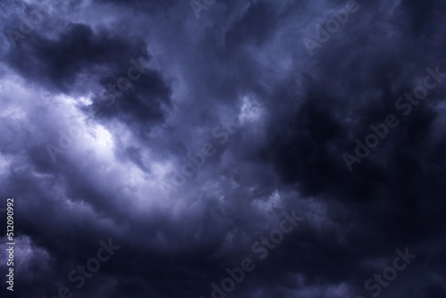 Storm sky with dark blue violet cumulus rainy clouds background texture, thunderstorm