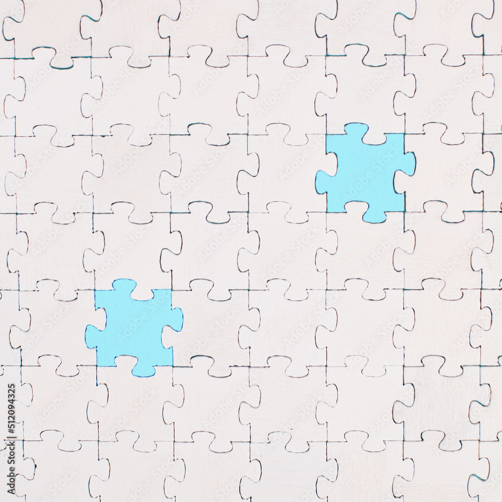 White jigsaw on a blue background, missing parts, working together as a team, searching for solutions, the last piece White jigsaw on a blue background, missing parts, working together as a team, searching for solutions, the last piece