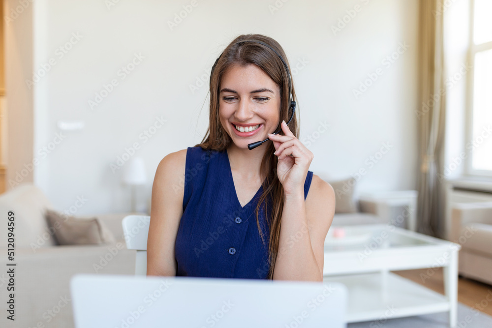 young call centre agent working in an office. Portrait of a cheerful young businesswoman talking on a headset to clients while working inside of the office young call centre agent working in an office. Portrait of a cheerful young businesswoman talking on a headset to clients while working inside of the office