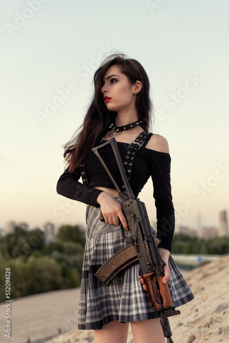 Girl with a gun in her hands