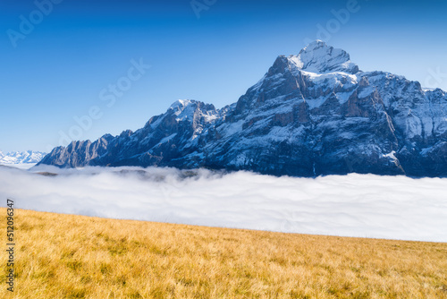 Mountains and clouds in the valley. Natural landscape high in the mountains. ...