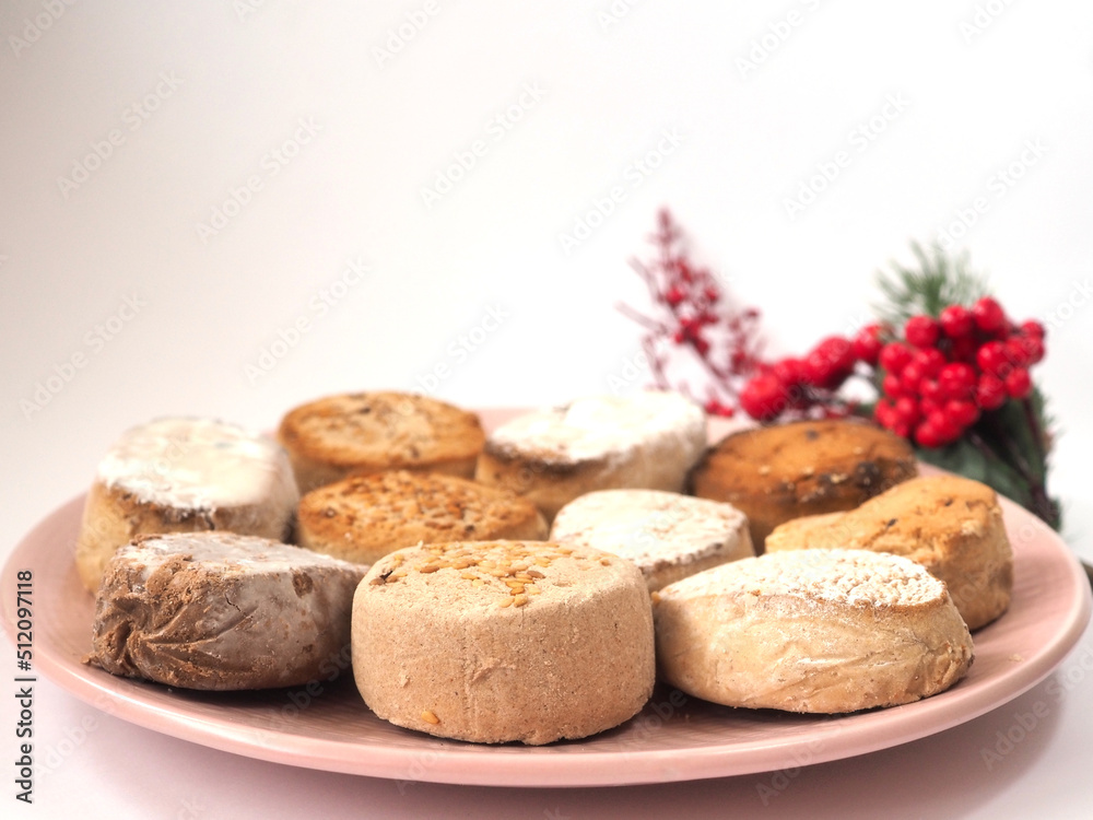 Polvorones, Nougat traditional Spanish Christmas mantecados with Christmas decoration on white table