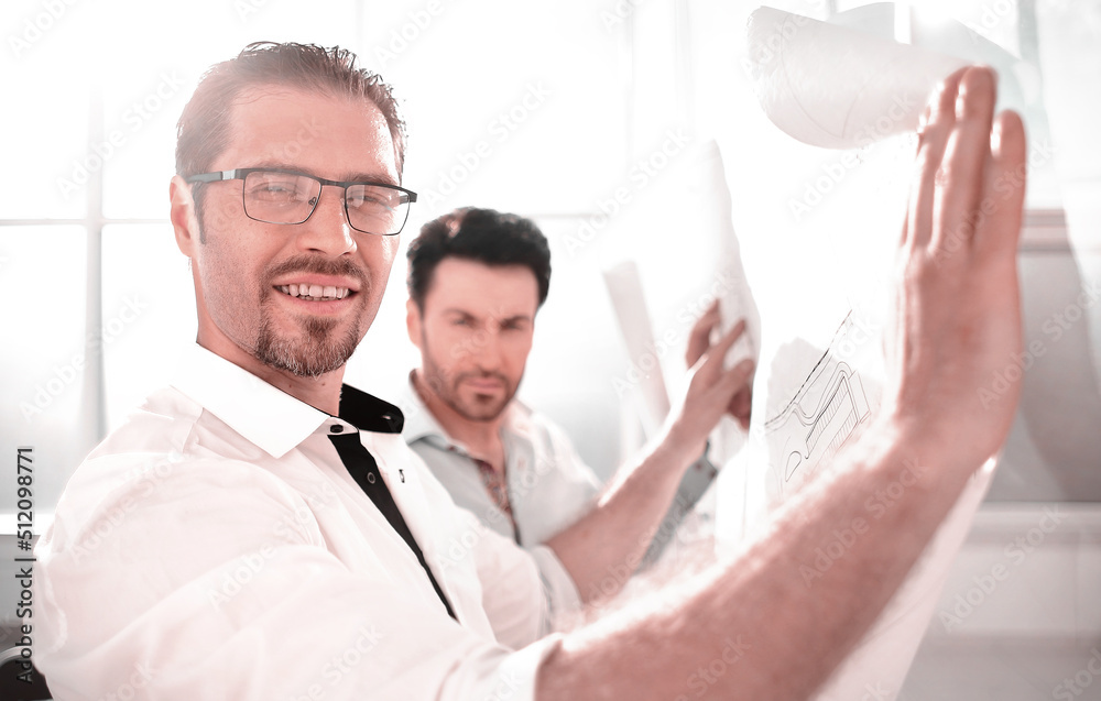 close up.two architects working in a modern office close up.two architects working in a modern office