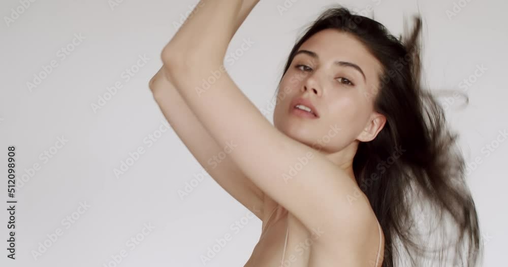 Close-up beauty portrait of young brunette woman with a perfect skin. Beauty model look up into the camera. Skin care product results concept. Skincare treatment, cosmetics. professional fashion model Close-up beauty portrait of young brunette woman with a perfect skin. Beauty model look up into the camera. Skin care product results concept. Skincare treatment, cosmetics. professional fashion model