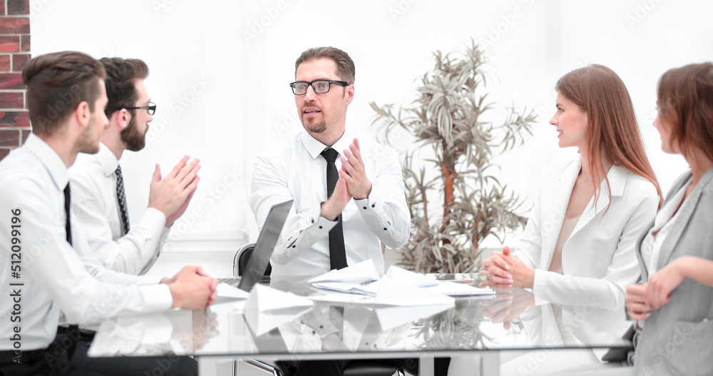 successful business team sitting at the Desk successful business team sitting at the Desk