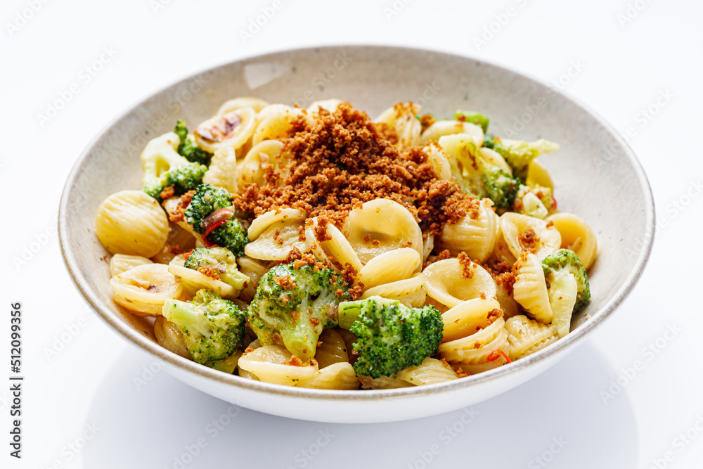 orequette pasta with broccoli on a white background orequette pasta with broccoli on a white background