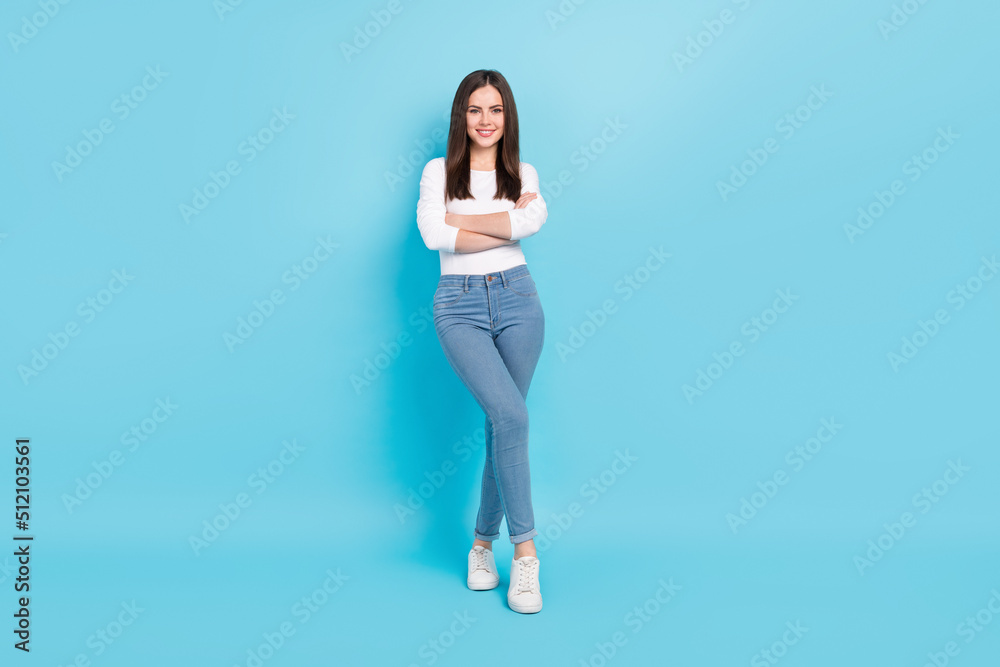 Full size photo of good looking business lady with folded arms posing on camera isolated on blue color background
