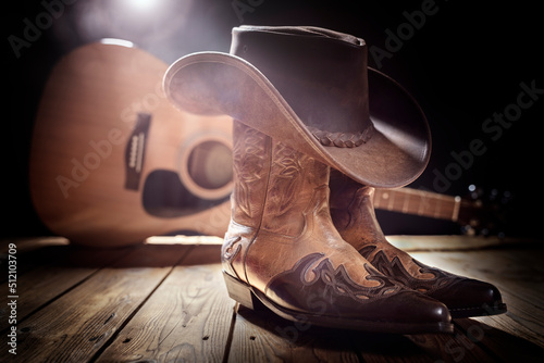 Billede på lærred Country music festival live concert with acoustic guitar, cowboy hat and boots