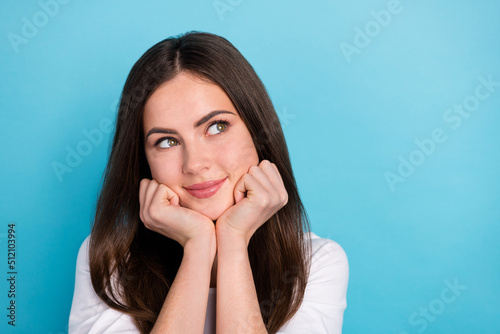 Photo of cute dreamy gorgeous lady look empty space daydreaming enjoy weekend isolated on blue color background
