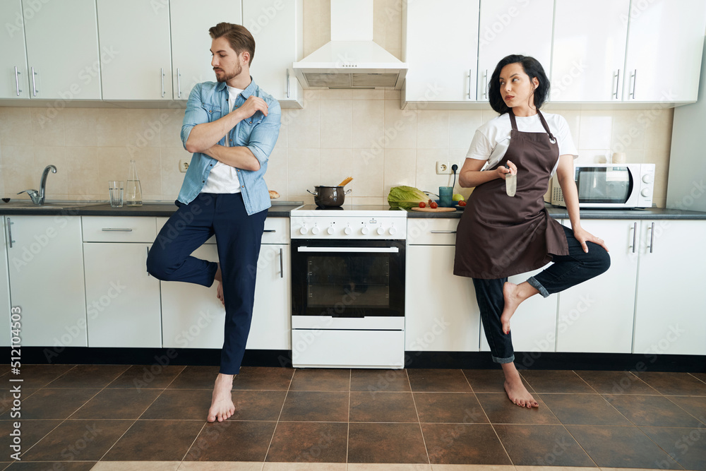 Offended man ignoring his female companion after argument Offended man ignoring his female companion after argument