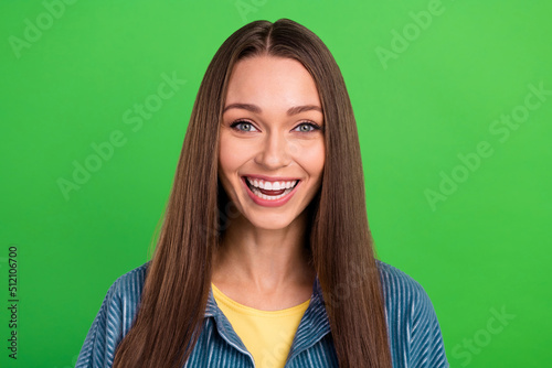 Portrait of charming positive girl toothy smile laughing good mood isolated on green color background