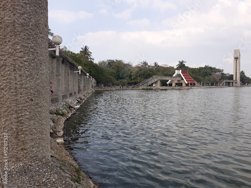 Stone bridge over a lake with nature behind in villahermosa, tabasco sideview (ID: 512107538)