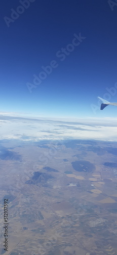Clear sky view from the airplane wing (ID: 512107592)