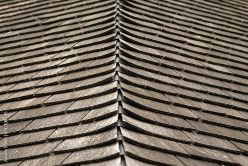 Wooden roof tiles. Old and weathered material.