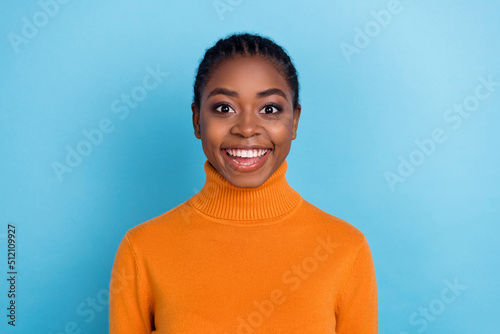 Photo of lovely positive cheerful candid lady shiny beaming smile wear orange shirt isolated blue color background