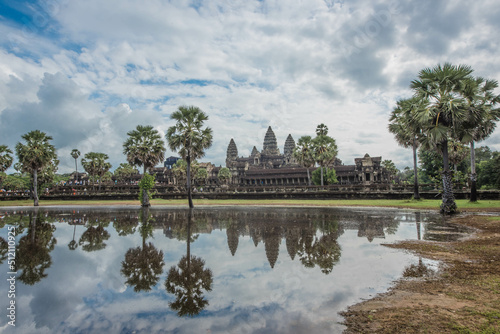 Angkor Wat, an ancient sandstone castle, is a world heritage site in the reflection of water in a pond in front of Siem Reap, Cambodia © Chay