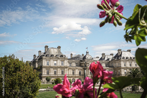Wallpaper Mural Flower in the foreground against the backdrop of a garden and French architecture Torontodigital.ca