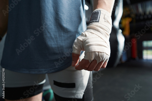 Professional sportsman with elastic bandage wrapped around his wrist