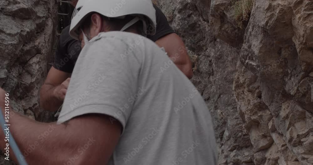 Getting his climbing equipment of him Getting his climbing equipment of him