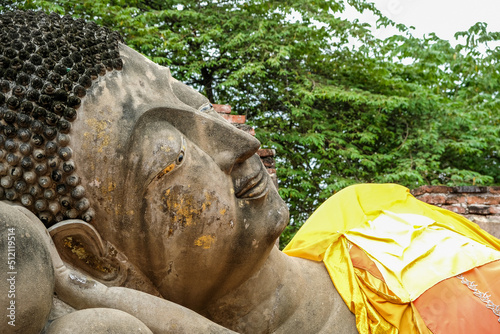 Ancient Reclining Buddha statue at Wat Phutthaisawan in Sampao Lom subdistrict, Phra Nakorn Sri Ayutthaya ,Thailand. photo