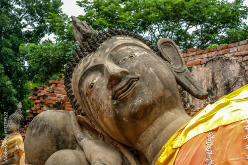 Ancient Reclining Buddha statue at Wat Phutthaisawan in Sampao Lom subdistrict, Phra Nakorn Sri Ayutthaya ,Thailand. photo