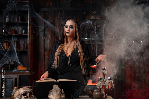 Halloween, witch use magic book and cauldron prepare poison or love potion
