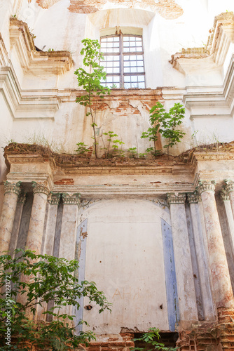 Old destroyed church. Ruins of  catholic Church. Old dilapidated  building with red brick columns. Historical value 18th century. Lyskovo, Belarus photo