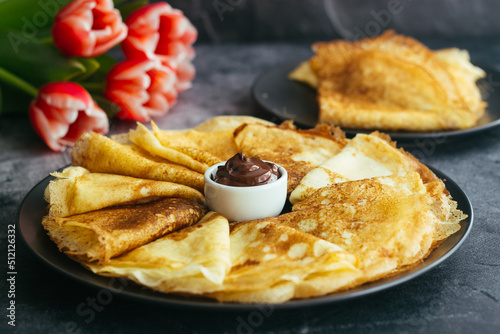 Delicious pancakes on a plate. Pancakes with chocolate