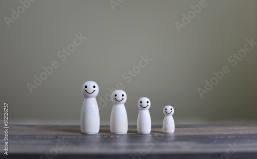Smile emoticon icons face happy symbol on wood doll happy life concept
