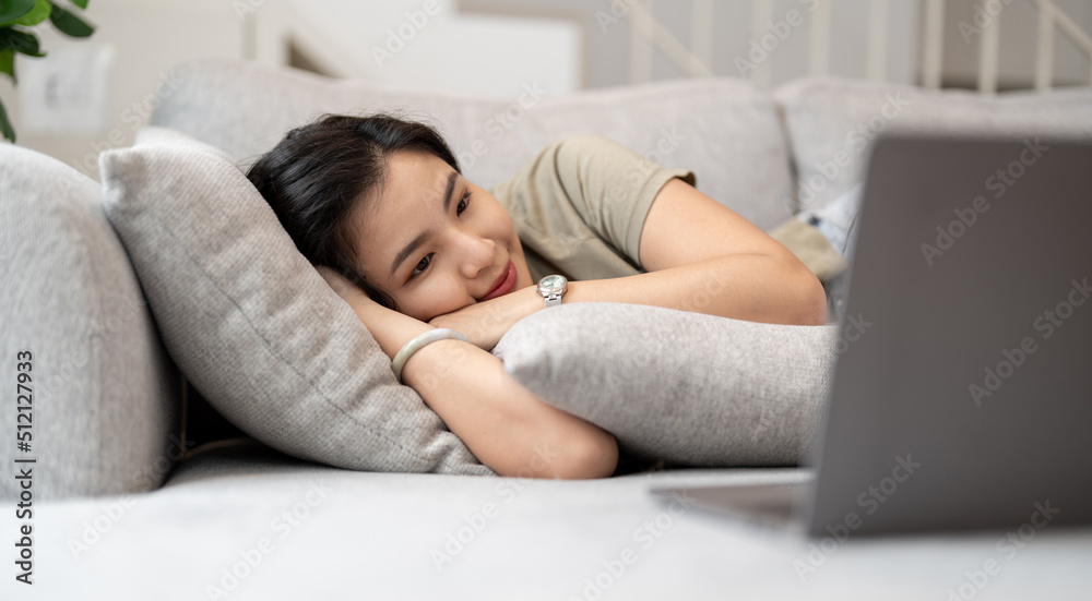beauty asian woman watch video tv series on laptop computer happily on the bed at home beauty asian woman watch video tv series on laptop computer happily on the bed at home