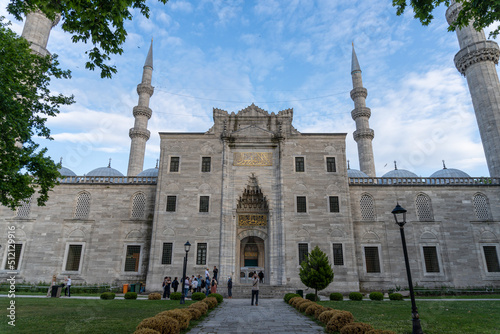 Entrance gate to the courtyard of the Suleiman's Mosque in Istanbul. At sunset with a blue sky with few clouds. photo