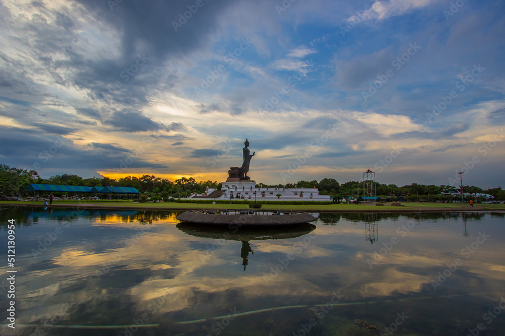 sunset sky and Buddha statue at  Phutthamonthon(Buddhist park in Nakhon Pathom Province of Thailand)