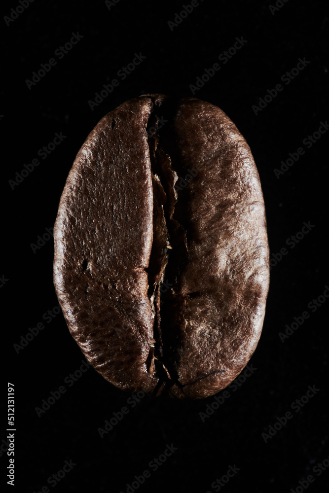 Roasted coffee beans isolated close up on black background, clipping path