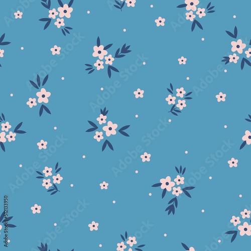 Simple vintage pattern. small pink flowers and dots  dark blue leaves. Blue background. Fashionable print for textiles and wallpaper.
