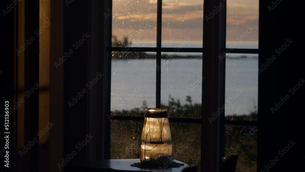 Modern summer cabin interior details with endless lake scene through window Modern summer cabin interior details with endless lake scene through window
