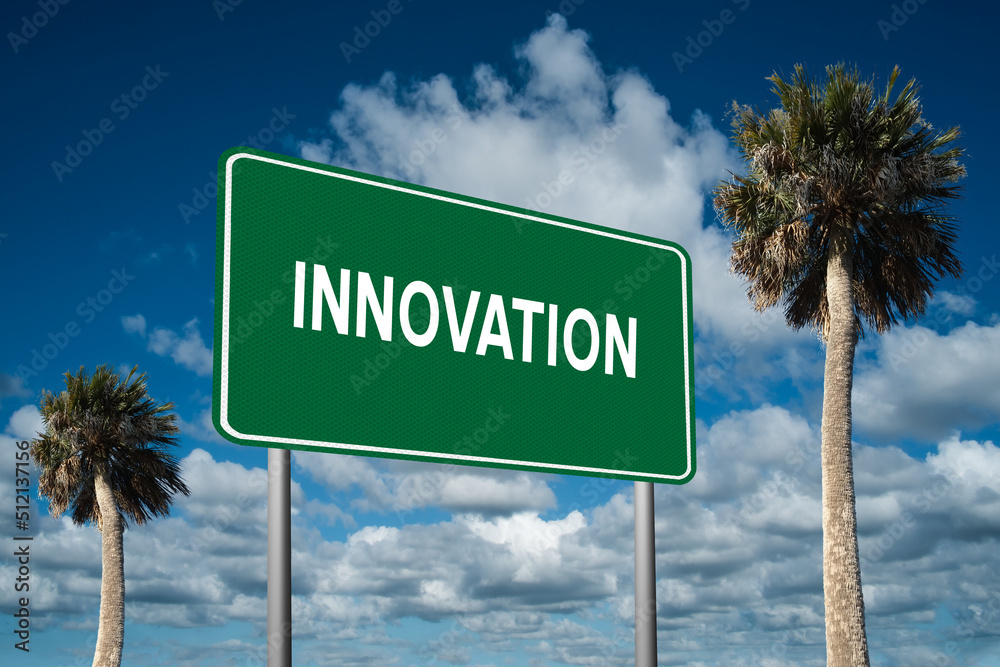 Fototapeta premium Highway sign with the word Innovation on a beautiful blue sky background with palm trees. Motivational concept for finding what we want on the journey of life.
