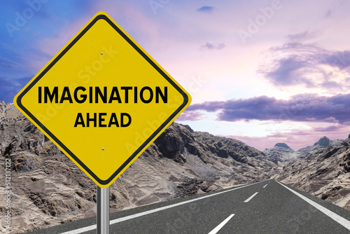 Canvas Print Yellow highway sign with the word Imagination and a metaphoric road leading to future success