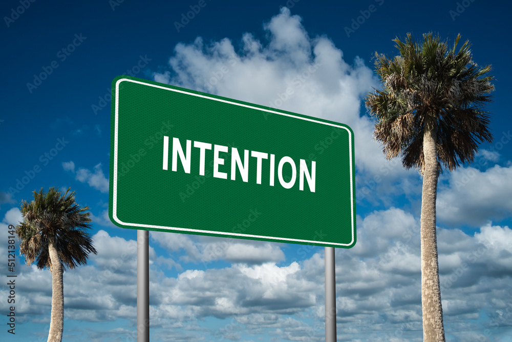 Highway sign with the word Intention on a beautiful blue sky background with palm trees.  Motivational concept for finding what we want on the journey of life.