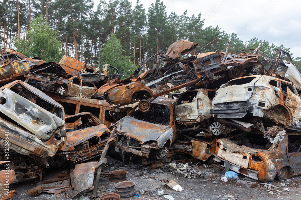 War in Ukraine. Car graveyard in Irpin. Shot cars of civilians. War in Ukraine. Car graveyard in Irpin. Shot cars of civilians.