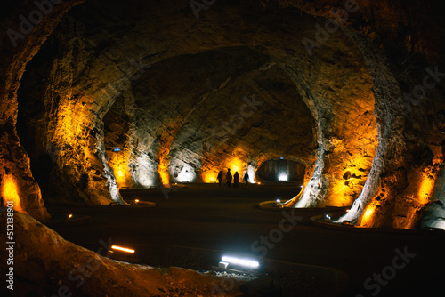 Group of muslim woman tourist walk in tuzluca salt mine tunnel. Famous travel destination in eastern anatolia, Turkey photo