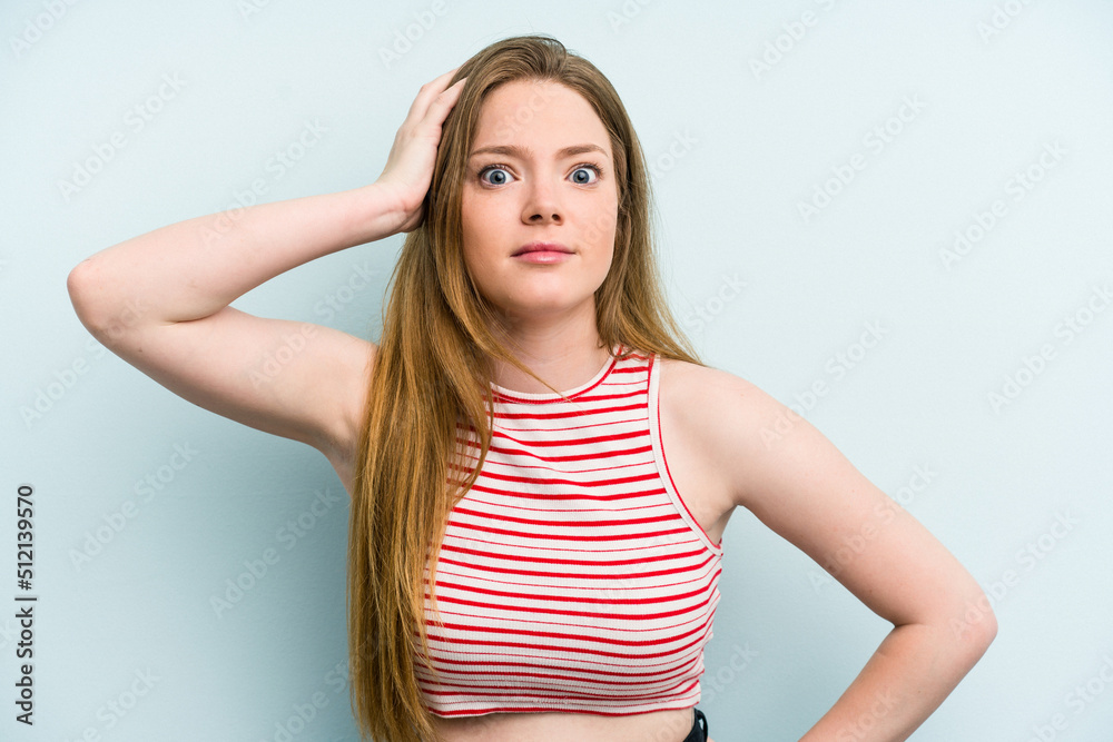 Fototapeta premium Young caucasian woman isolated on blue background being shocked, she has remembered important meeting.