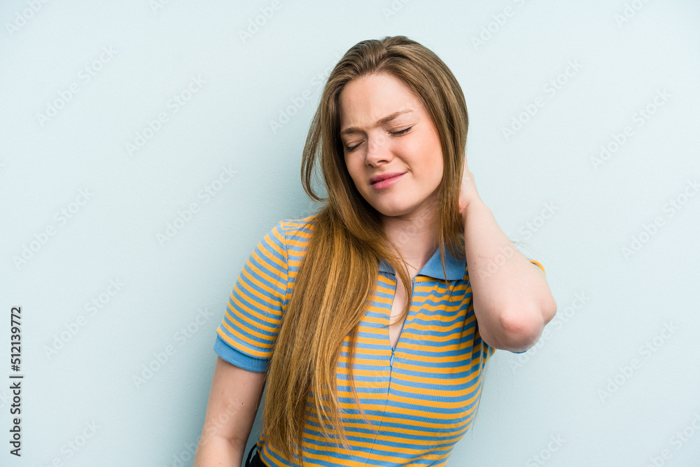 Young caucasian woman isolated on blue background having a neck pain due to stress, massaging and touching it with hand. Young caucasian woman isolated on blue background having a neck pain due to stress, massaging and touching it with hand.
