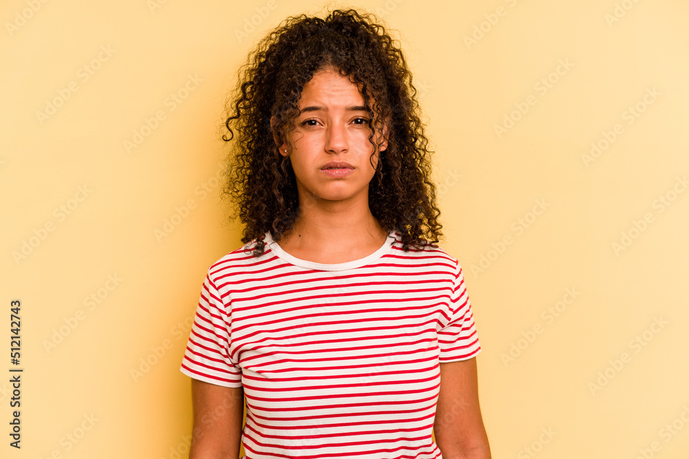 Young Brazilian woman isolated on yellow background sad, serious face, feeling miserable and displeased. Young Brazilian woman isolated on yellow background sad, serious face, feeling miserable and displeased.