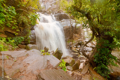 Beautiful Bamni waterfall having full streams of water flowing downhill amongst stones , duriing monsoon due to rain at Ayodhya pahar (hill) - at Purulia, Bengal - formerly West Bengal, India. photo