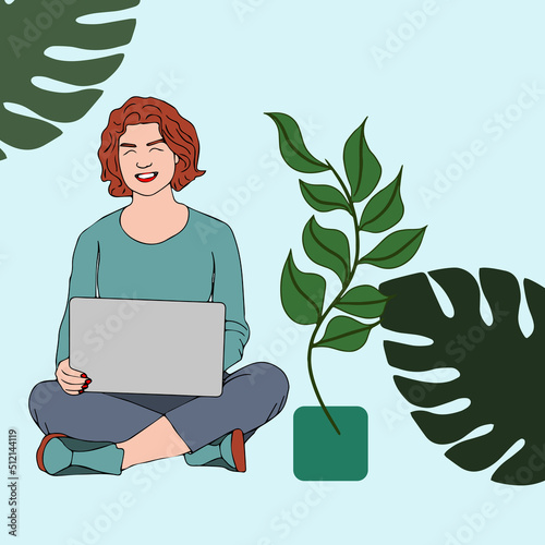 Woman working with computer in the graden. Using laptop in nature.